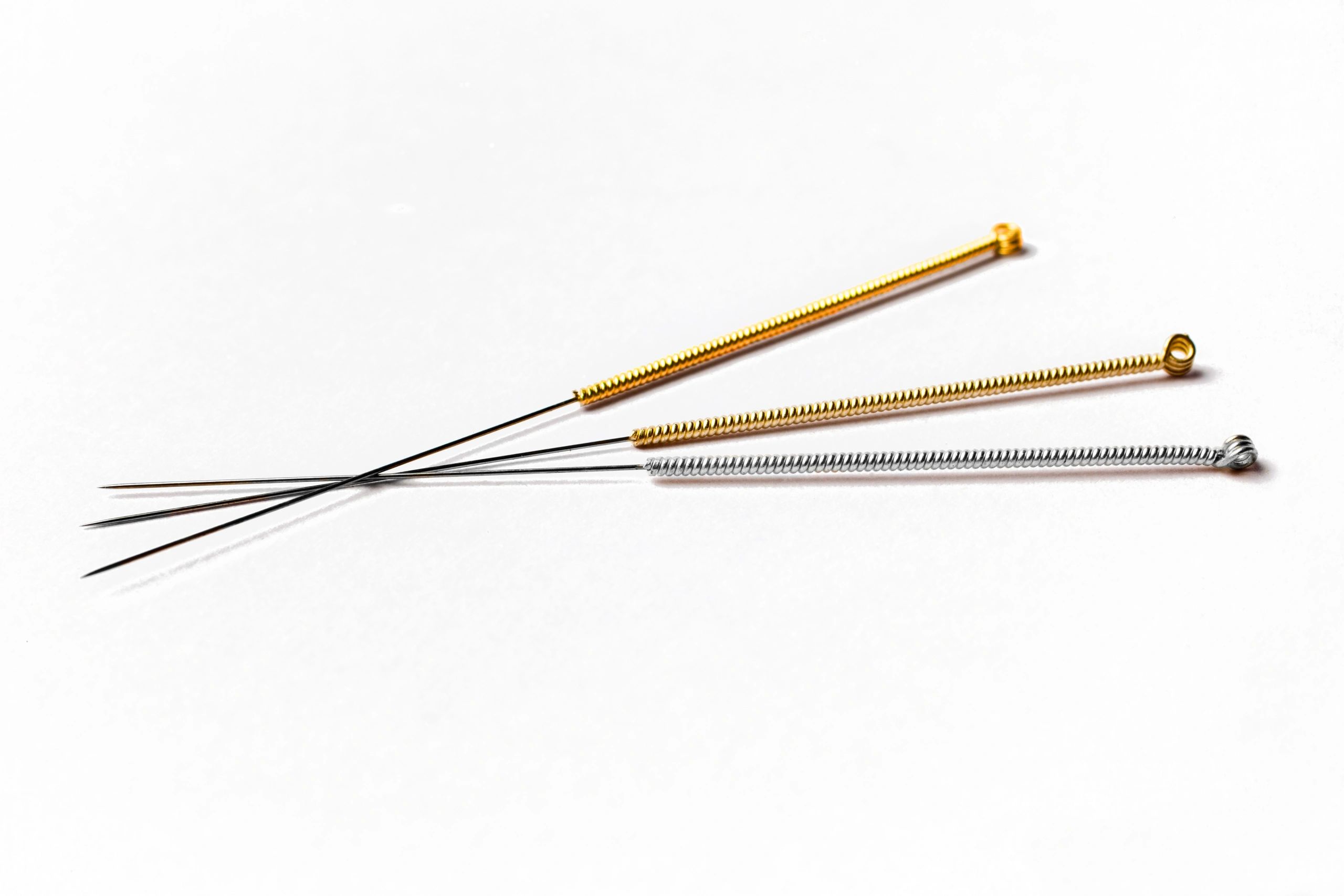 Close-up acupuncture needle — precise technique